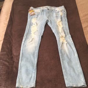 Machine light washed distressed denim jeans